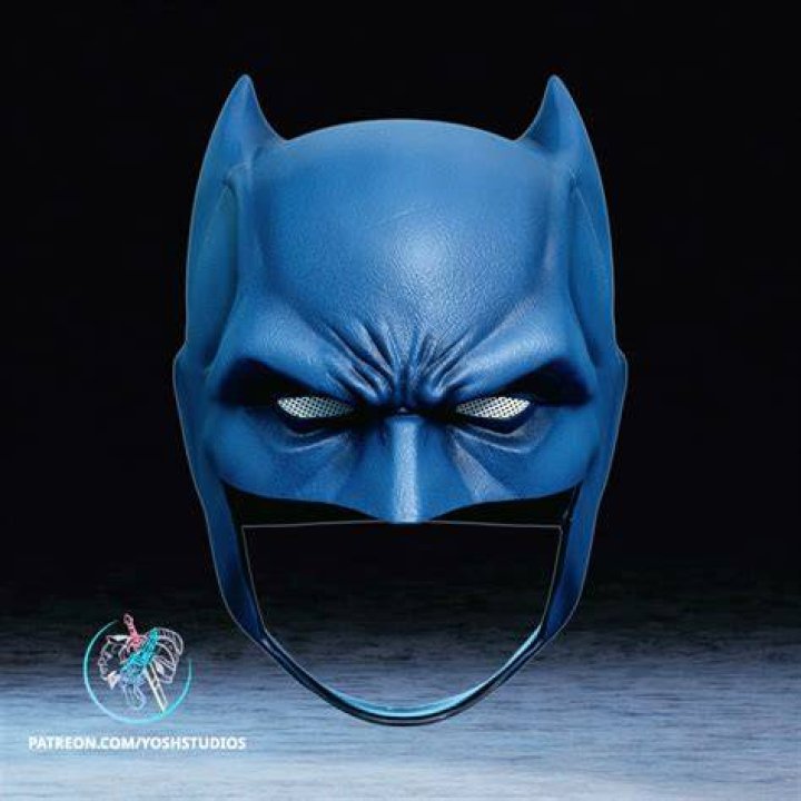 Detective Holds Mask