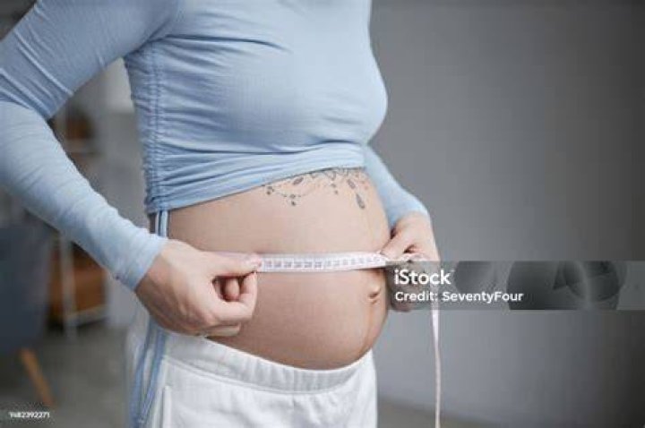 Woman Measuring Belly